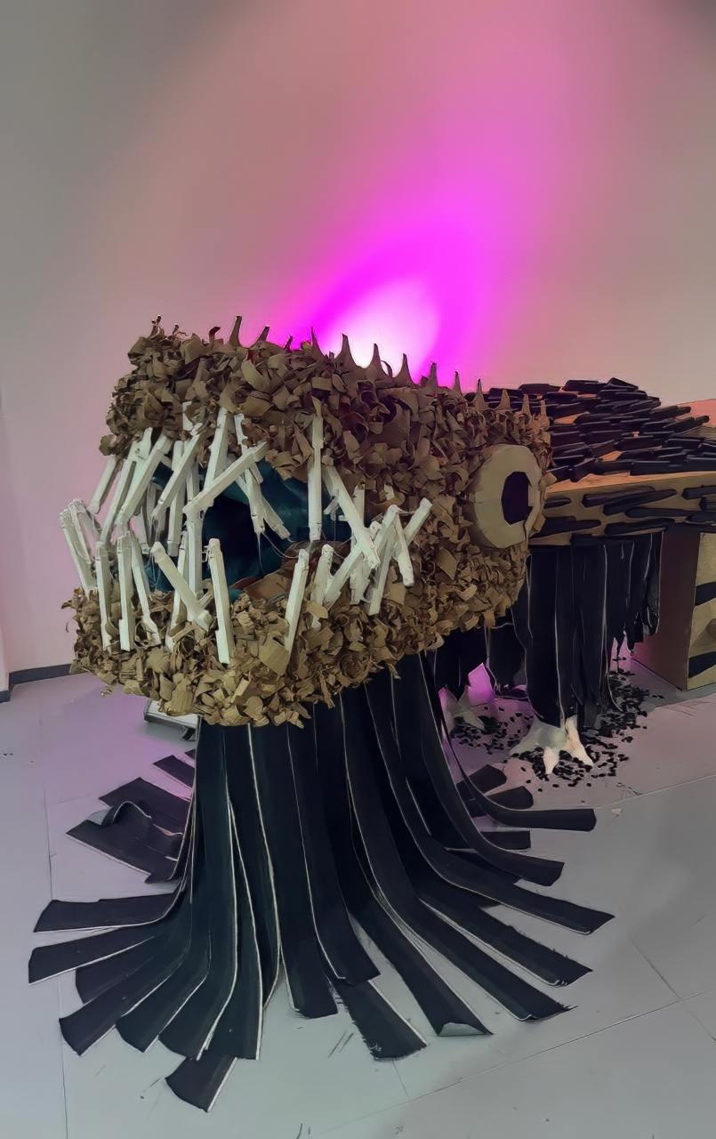 Head detail: cardboard, plastic tubing and rubber